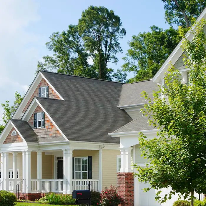 exterior of home with trees in front and back